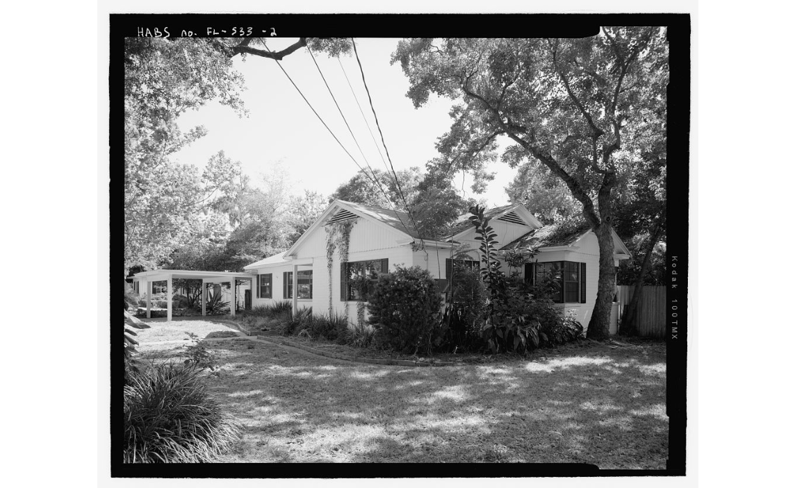 black and white image of a ranch style house